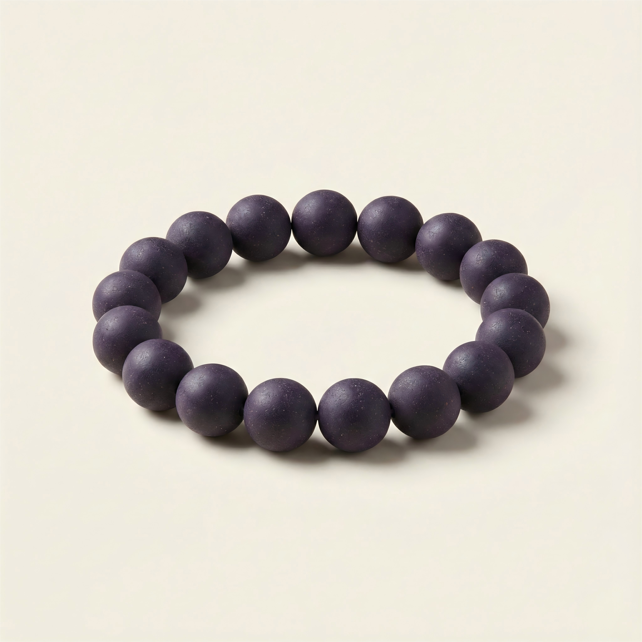 Hidden Scent handmade Royal Purple herbal incense bead bracelet for good fortune and charisma on neutral background.